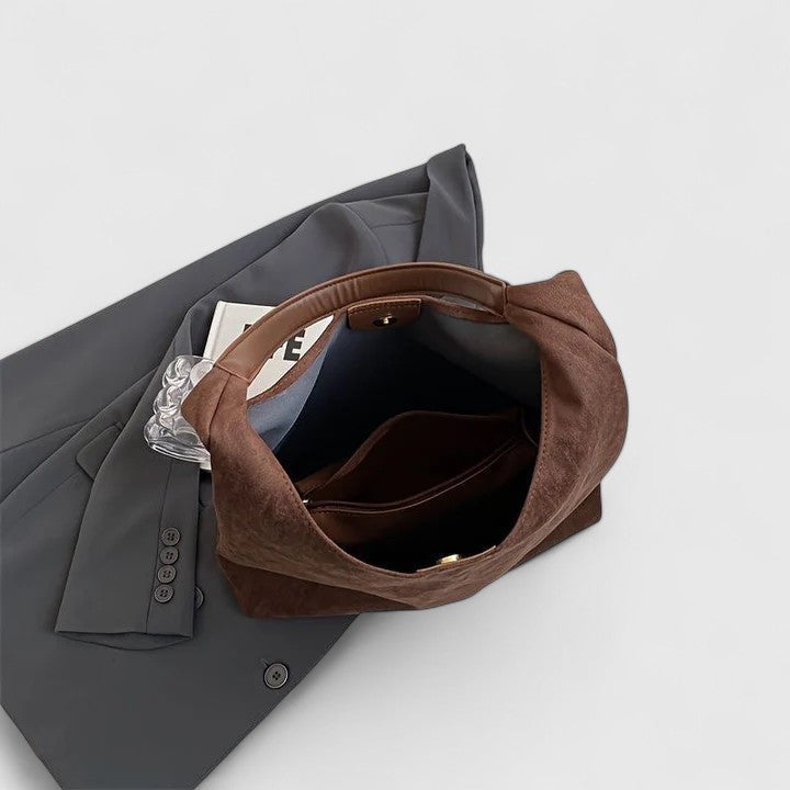 Rovena minimalist shoulder bag shown in a neutral tone with clean, simple design