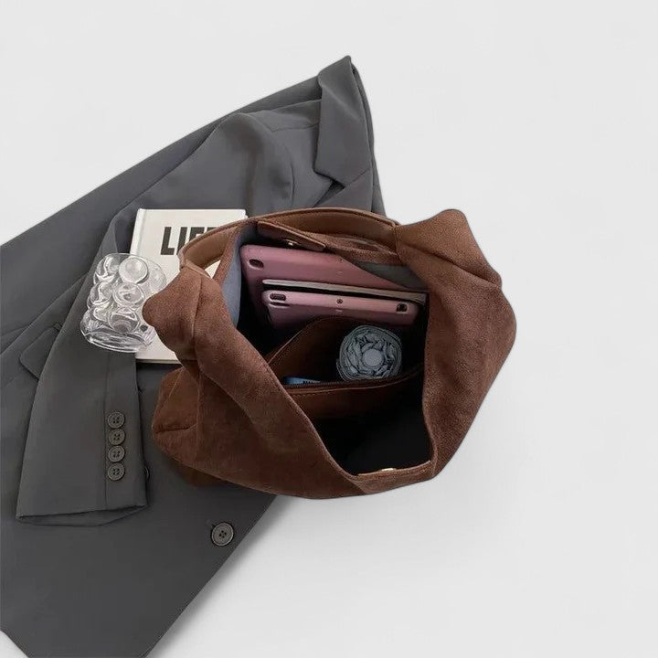 Rovena minimalist shoulder bag shown in a neutral tone with clean, simple design