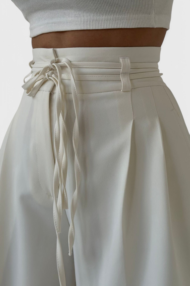 Sophie high-waisted wide-leg trousers with cord accents shown in neutral tones
