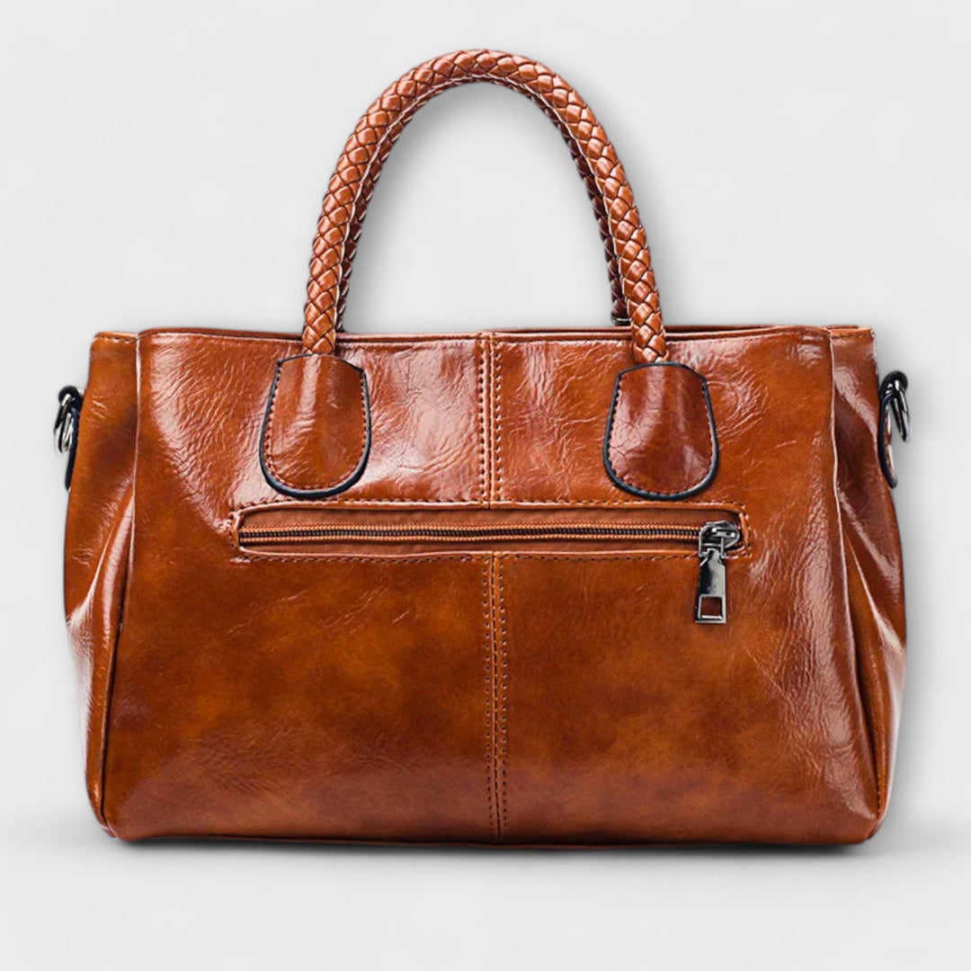 Thyra structured handbag with braided handles and shoulder strap