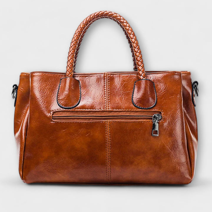 Thyra structured handbag with braided handles and shoulder strap