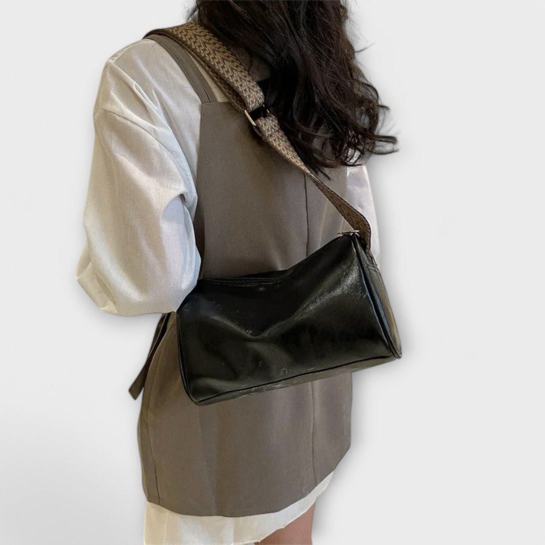 Sylindra modern shoulder bag with wide woven strap in a neutral tone