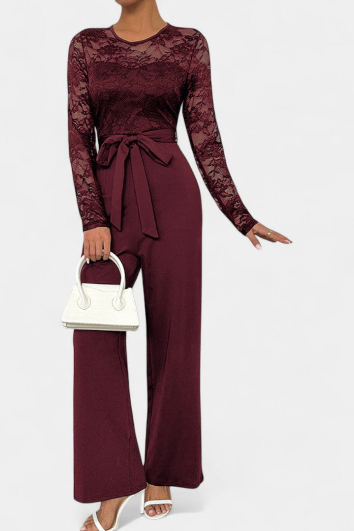 Éviana lace jumpsuit with sheer sleeves, wide-leg trousers and tied waist