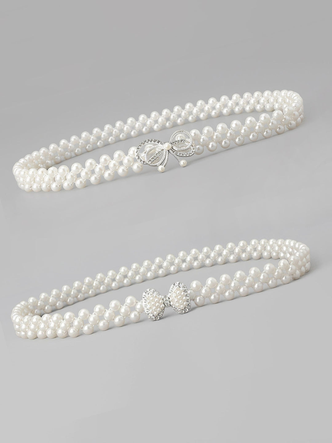 Set of two imitation pearl and rhinestone chain belts in silver and white
